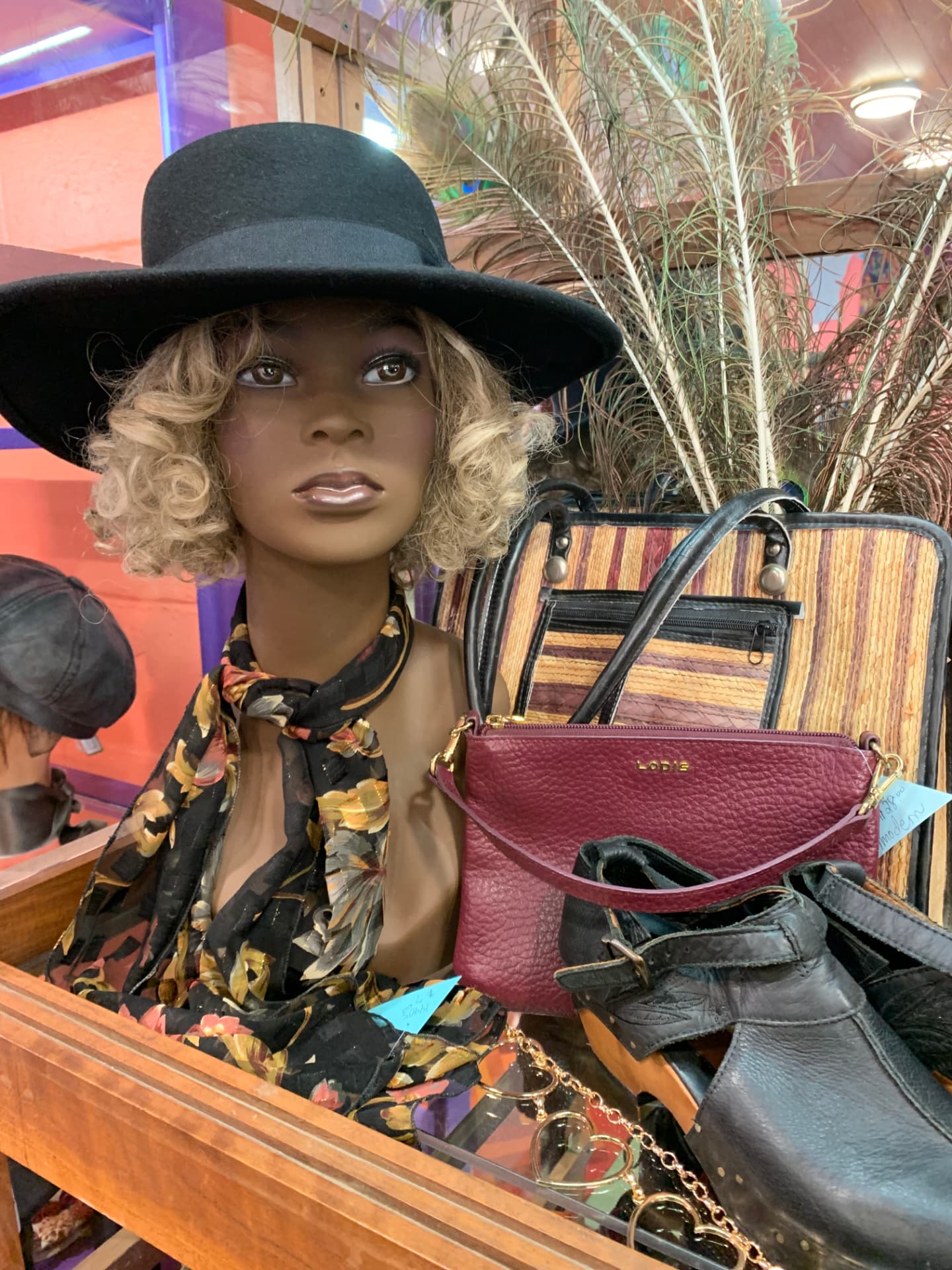 Black wide-brim hat, scarf, purses, and leather clogs