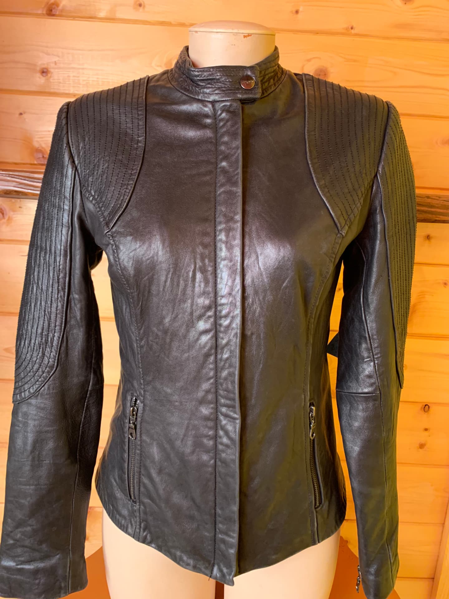 Black leather moto jacket with ribbed shoulders