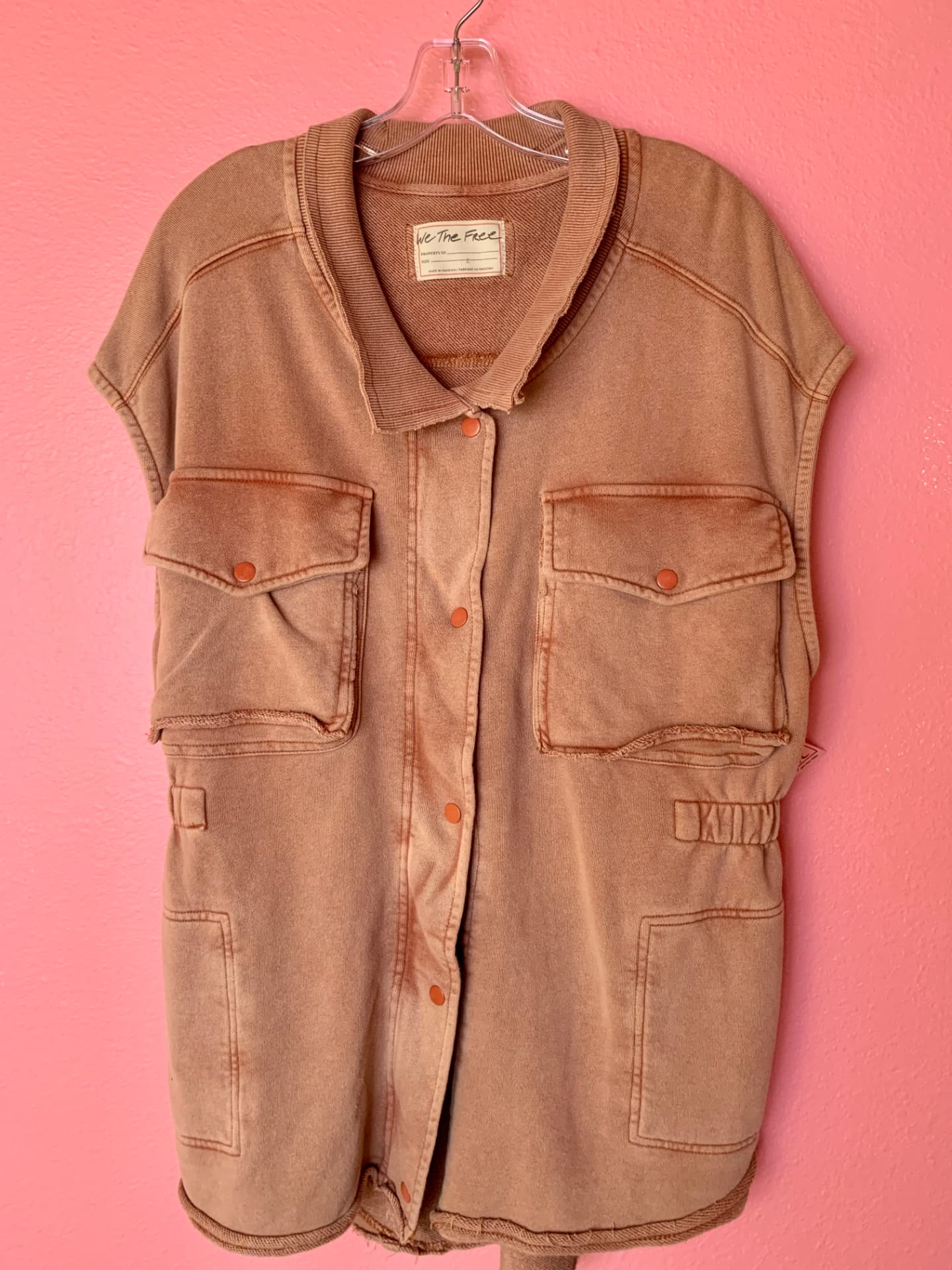 Rust sleeveless utility vest with snap front