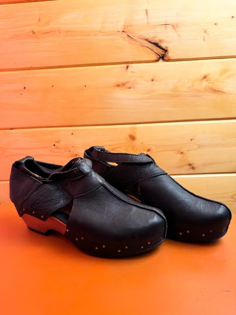 Black leather clogs